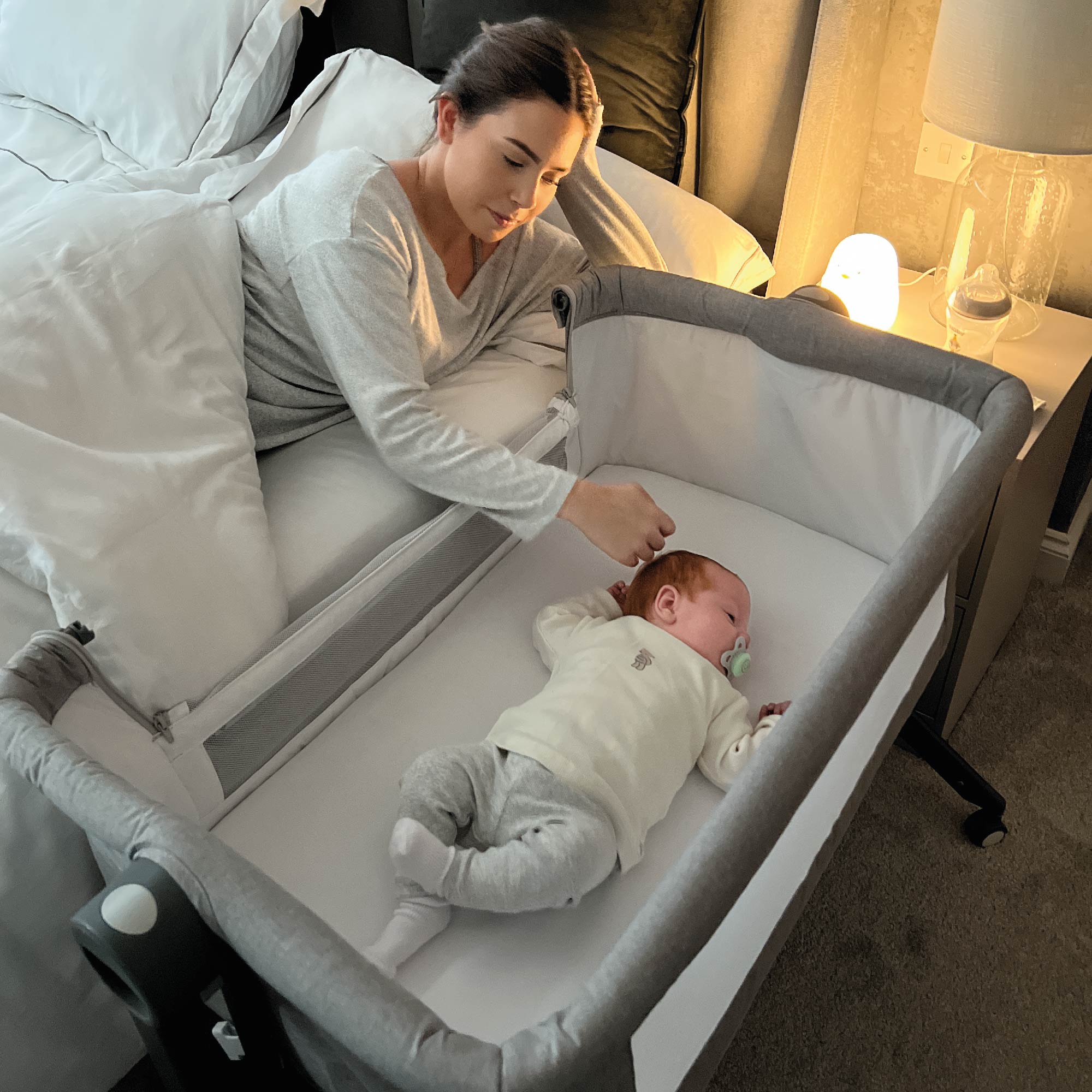 Baby next to store bed sleeper